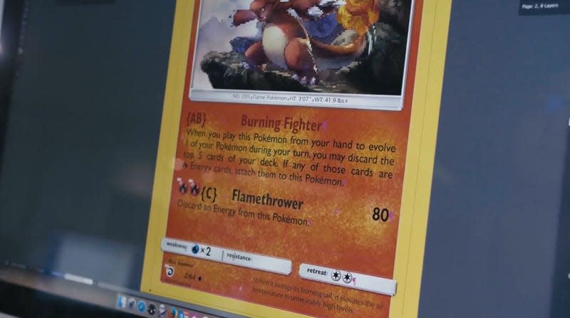 A Charmander card being typed out on screen.