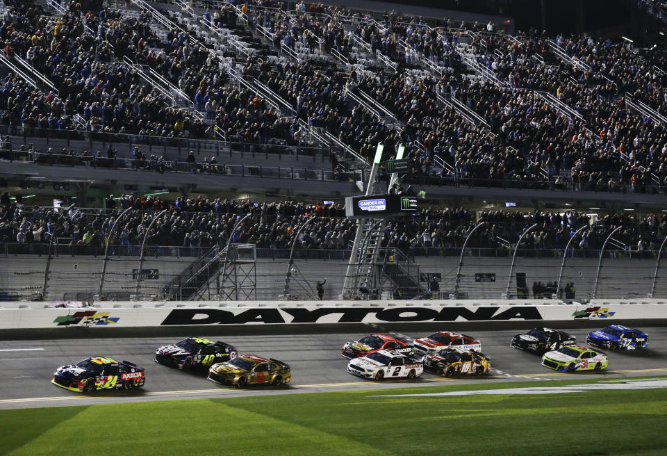 Pole-sitter William Byron (24) leads Jimmie Johnson (48), Daniel Hemric (8) and the rest of the field to start the first of two qualifying auto races for the NASCAR Daytona 500 at Daytona International Speedway, Thursday, Feb. 14, 2019, in Daytona Beach, Fla. (AP Photo/Terry Renna)