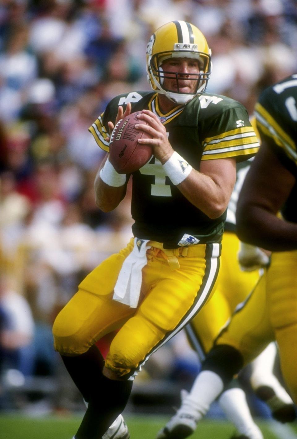 Quarterback Brett Favre of the Green Bay Packers looks to pass the ball during a game against the Cincinnati Bengals at Lambeau Field in Green Bay on Sept. 20, 1992. The Packers won the game, 24-23.