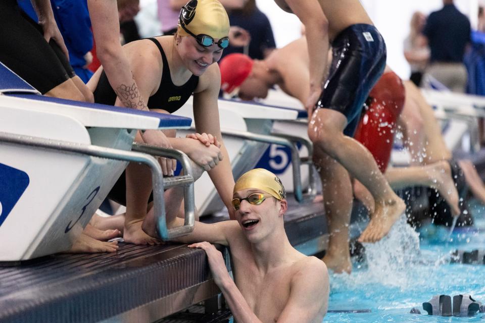 Xander Berg of Lone Peak High School is congratulated by teammates after competing at the Utah 6A State Meet at the Stephen L. Richards Building in Provo on Saturday, Feb. 24, 2024. | Marielle Scott, Deseret News