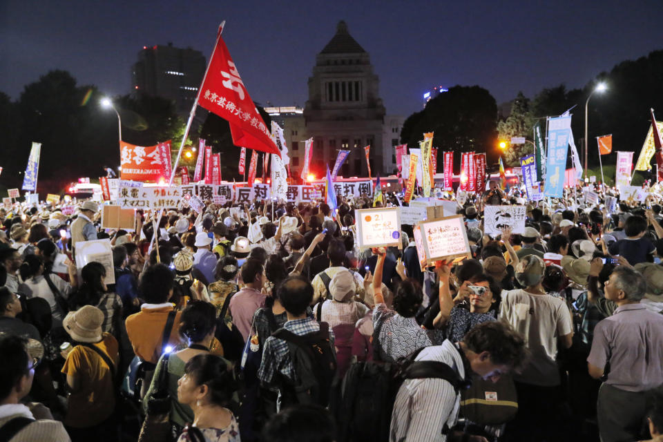 Anti-nuclear protesters stage a rally outside Japan's parliament complex in Tokyo, Sunday, July 29, 2012. Thousands of the protesters rallied to demand the government abandon nuclear power after the accident last year in northern Fukushima. (AP Photo/Itsuo Inouye)