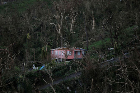 A damaged house is seen after the area was hit by Hurricane Maria in Yabucoa, Puerto Rico September 22, 2017. REUTERS/Carlos Garcia Rawlins