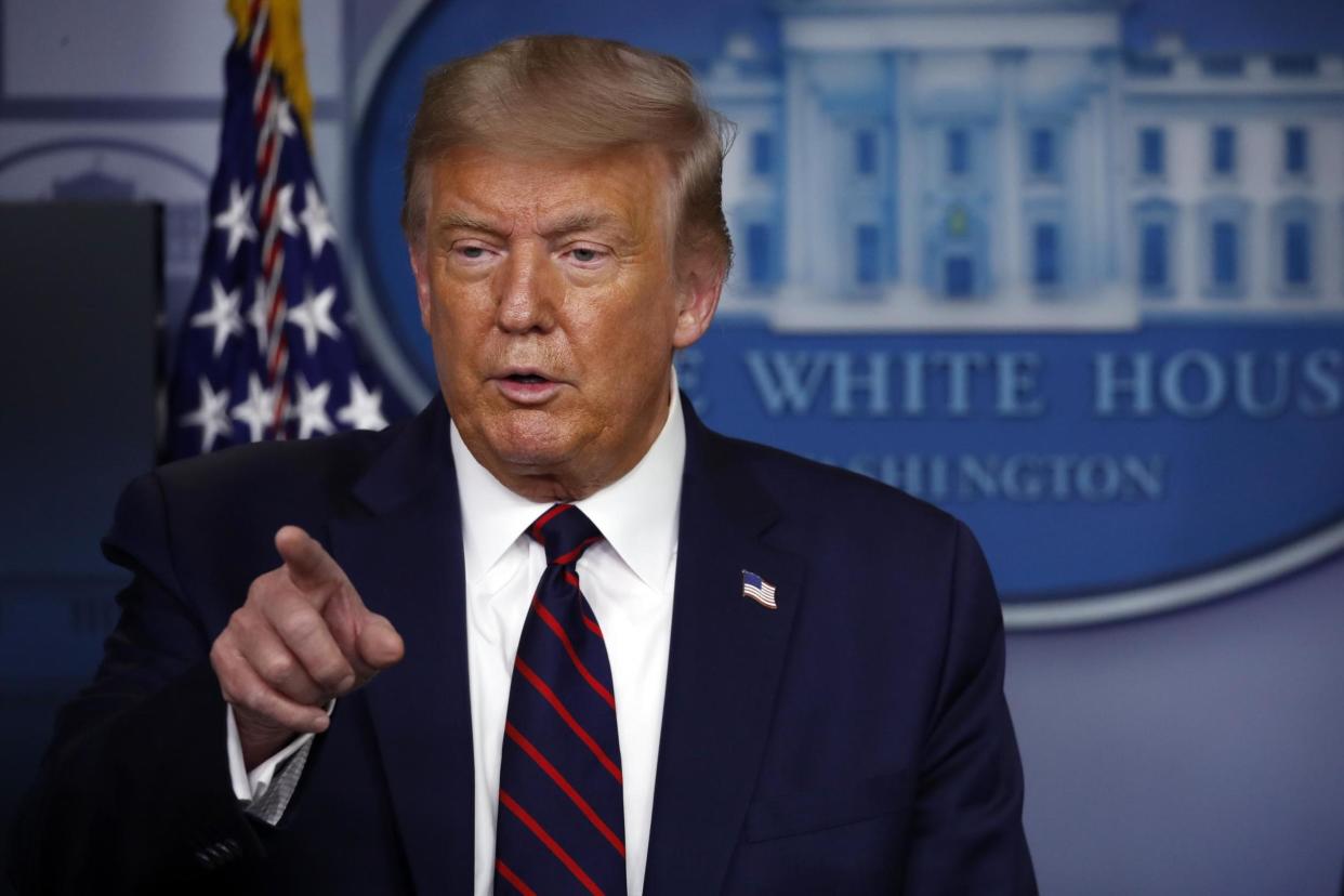 President Trump speaks during a briefing with reporters at the White House: AP