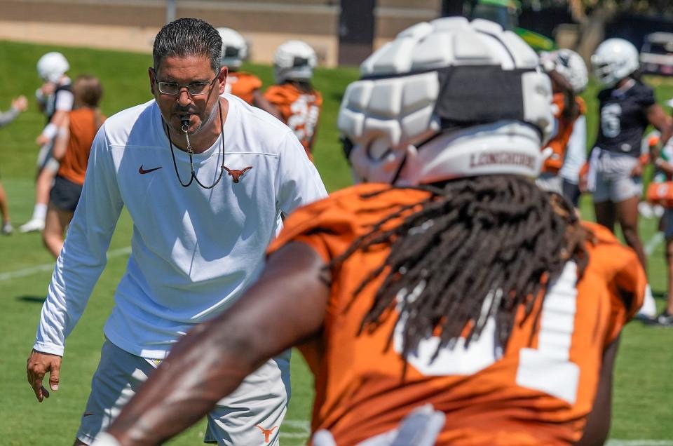 Texas Longhorn special teams coach Jeff Banks works out his players during their second day of preseason practice at the Denius Fields on Thursday, Aug. 3, 2023. 