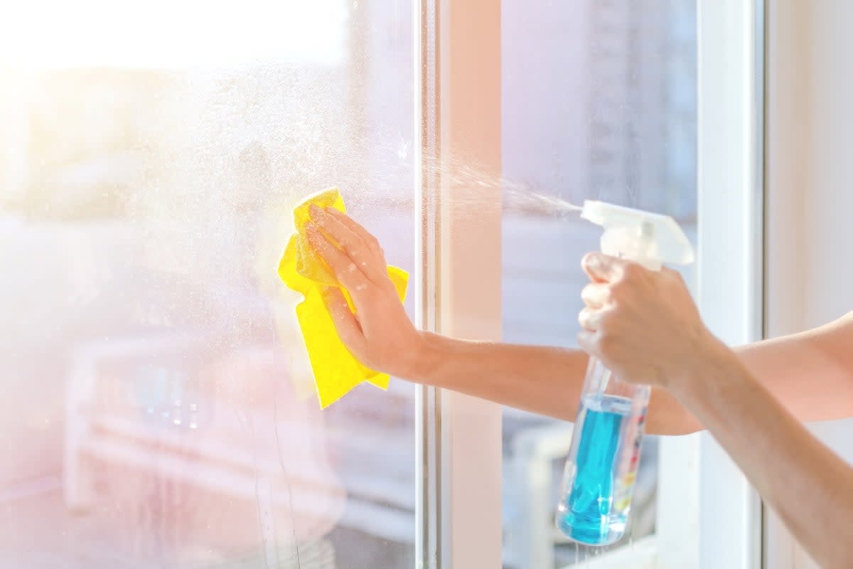 Spraying window with windex