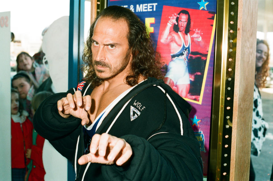 Wolf from Gladiators opening the new Blockbuster Video in Reading, 6th November 1994. (Photo by Staff/Mirrorpix/Getty Images)