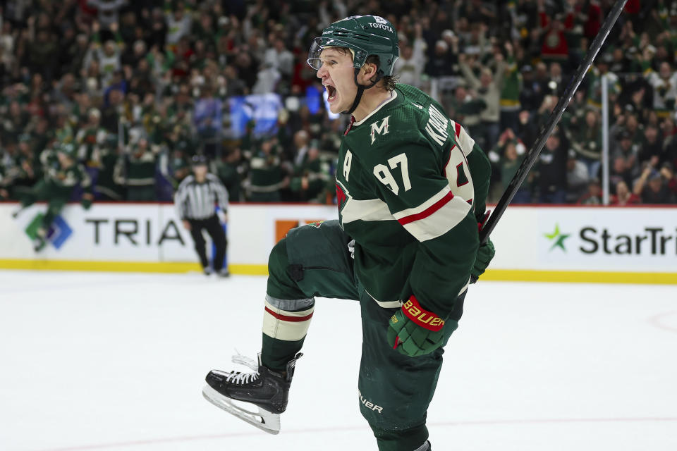 Minnesota Wild left wing Kirill Kaprizov (97) celebrates after his winning goal against the Montreal Canadiens during overtime of an NHL hockey game Thursday, Dec. 21, 2023, in St Paul, Minn. (AP Photo/Matt Krohn)