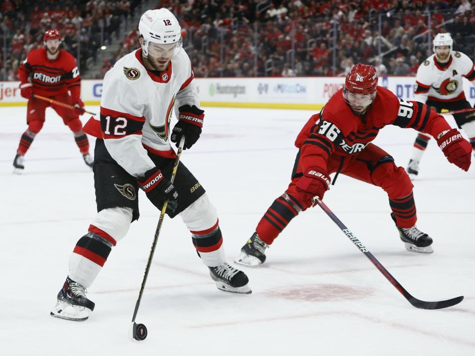 Ottawa Senators right wing Alex DeBrincat (12) drives toward the goal against Detroit Red Wings defenseman Jake Walman (96) during the second period at Little Caesars Arena in Detroit on Saturday, Dec. 31, 2022.