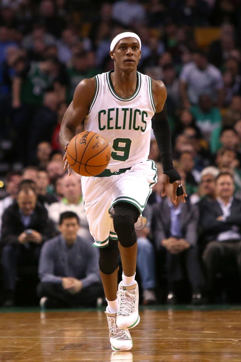 BOSTON, MA - NOVEMBER 05: Rajon Rondo #9 of the Boston Celtics brings the ball up court against the Toronto Raptors at TD Garden on November 5, 2014 in Boston, Massachusetts. NOTE TO USER: User expressly acknowledges and agrees that, by downloading and or using this photograph, User is consenting to the terms and conditions of the Getty Images License Agreement.  (Photo by Mike Lawrie/Getty Images)