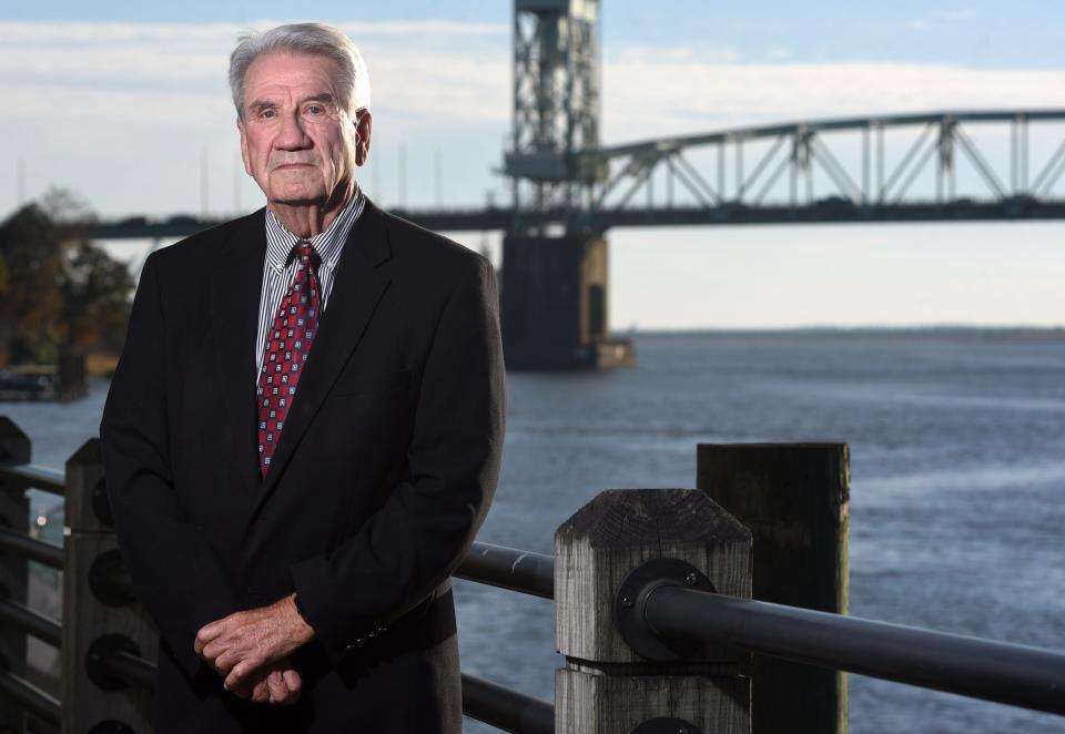 Gene Merritt stands along the Riverwalk in downtown Wilmington Wednesday, December 1, 2021. Merritt has played a huge role in the revitalization of downtown Wilmington.