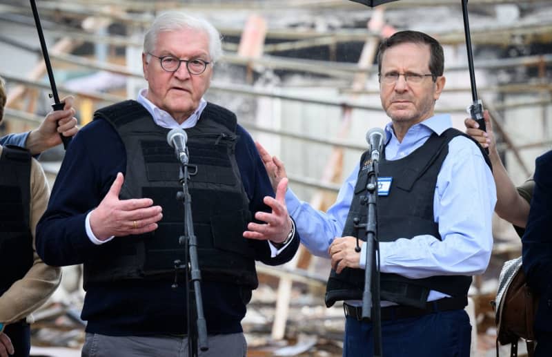 German President Frank-Walter Steinmeier (L) and Isaac Herzog, President of Israel, speak during a visit to Kibbutz Beeri in the border area with the Gaza Strip. Herzog is travelling to Berlin on 16 February to kick off his visit to Germany. After a meeting with Steinmeier, he will then travel to the Security Conference in Munich, Herzog's spokesman announced on 15 February. Bernd von Jutrczenka/dpa