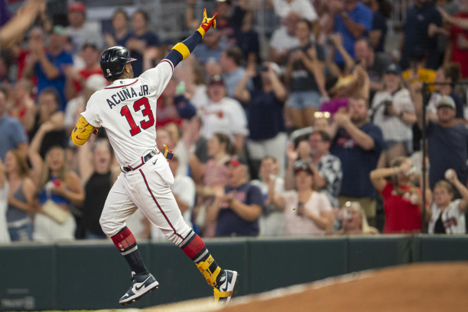 Atlanta Braves Ronald Acuna Jr. gestures after hitting a solo home run in the fifth inning of a baseball game against the Colorado Rockies Wednesday, Aug. 31, 2022, in Atlanta. (AP Photo/Hakim Wright Sr.)