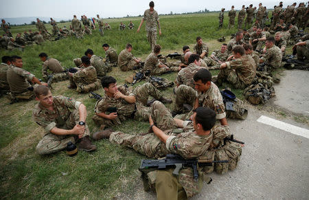 British servicemen rest after an opening ceremony of the NATO-led military exercises "Noble Partner 2018" at Vaziani military base outside Tbilisi, Georgia, August 1, 2018. REUTERS/David Mdzinarishvili