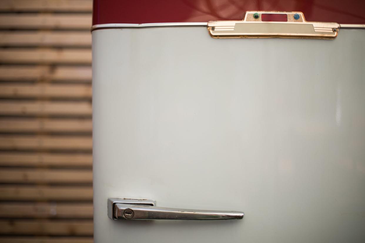 Close up shot of a vintage refrigerator.