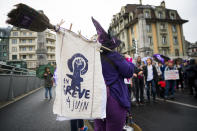 Women's protest during a nationwide strike on Friday, June 14, 2019, in Lausanne, Switzerland. There is list of several reasons motivating people to take part in the strike. These range from unequal wages to pressures on part-time employees, the burden of household work and sexual violence. (/Keystone via AP)