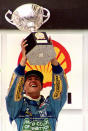 Schumacher holding his trophy after winning the Brazilian Grand Prix. (Reuters)