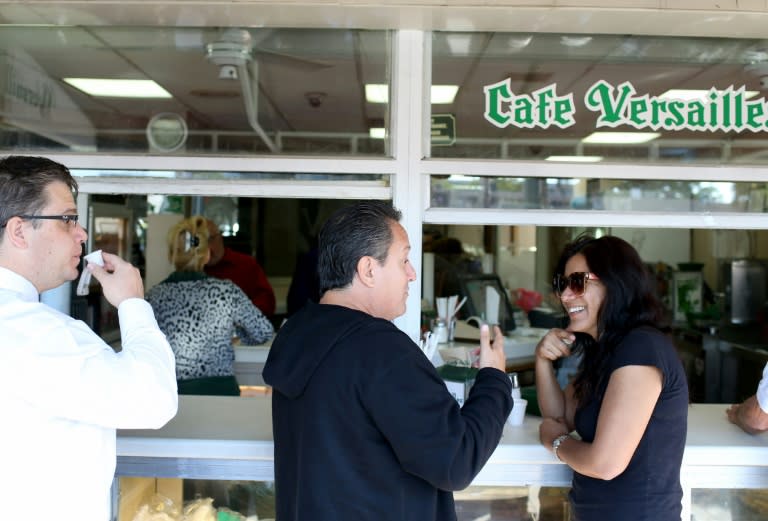 People enjoy their morning cafe at Cafe Versailles in the Little Havana neighborhood on December 18, 2014 in Miami, United States