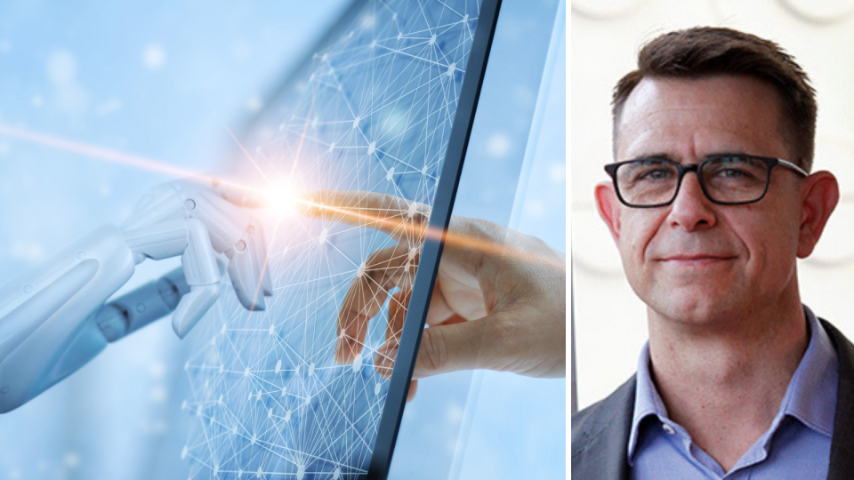 A robotic hand holds its index finger to a screen, where a human index finger meets it on the other side. Where the fingers touch, there is a bright light. On the right, Dr Sean Gallagher from Swinburne University is pictured. He wears black glasses, a blue shirt and he is smiling. 