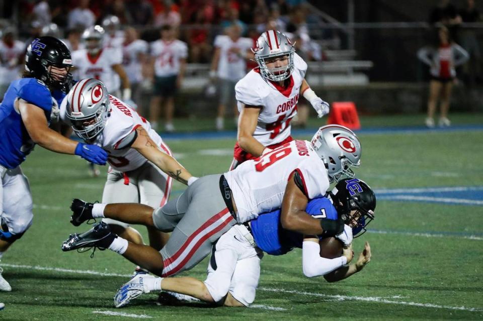 Four-star recruit Jerod Smith (99) tackles Lexington Catholic quarterback Jackson Wasik (7).