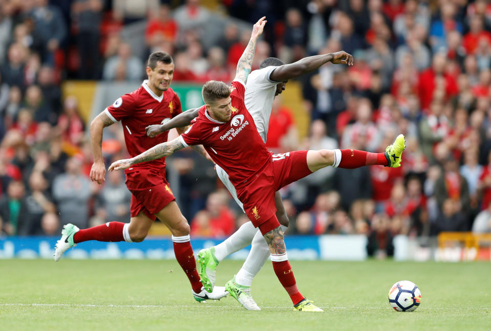 <p>Liverpool’s Alberto Moreno and Dejan Lovren combine to deny Romelu Lukaku</p>