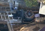 Emergency services personnel can be seen near a ride inside the Dreamworld theme park at Coomera on the Gold Coast, Australia. AAP/Dan Peled/via REUTERS