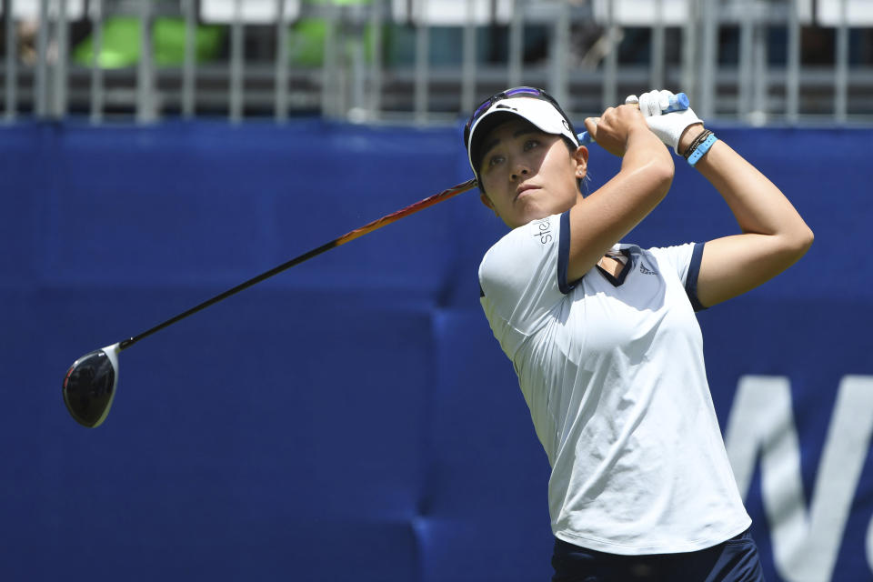 Danielle Kang watches her tee shot off the first hole during the final round of the LPGA Walmart NW Arkansas Championship golf tournament, Sunday, June 30, 2019, in Rogers, Ark. (AP Photo/Michael Woods)