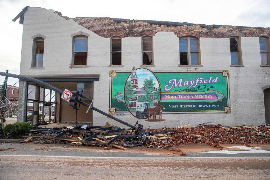 A building with an iconic Mayfield mural on the corner of West Broadway and South Seventh Street is heavily damaged following a tornado on Saturday, Dec. 11, 2021.