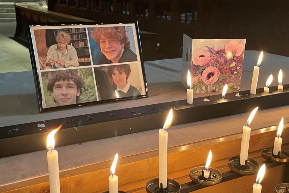Photographs of Jevon Hirst, Harvey Owen, Wilf Fitchett and Hugo Morris inside Shrewsbury Abbey, where people paid their respects (PA) (PA Wire)