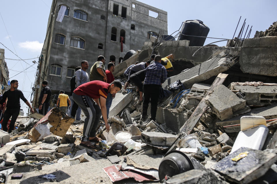 Palestinians inspect buildings damaged during Israeli airstrikes in Jabalia refugee camp, North Gaza strip on May 20, 2021.  (Photo by Sameh Rahmi/NurPhoto via Getty Images)