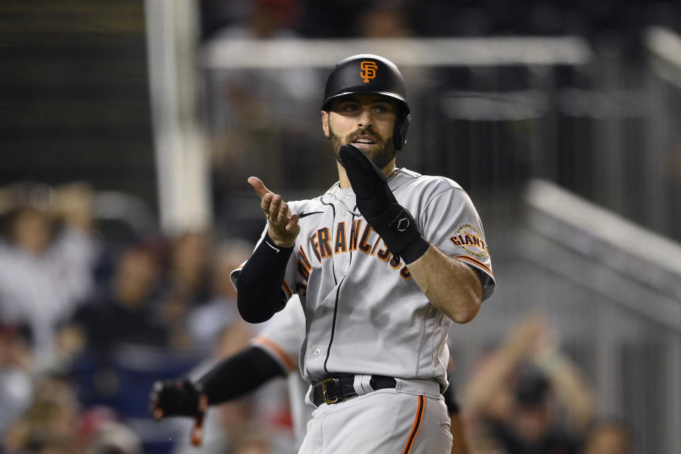 San Francisco Giants' Curt Casali reacts after he scored on a single by LaMonte Wade Jr. during the eighth inning of the second baseball game of a doubleheader against the Washington Nationals, Saturday, June 12, 2021, in Washington. The Giants won 2-1 in eight innings. (AP Photo/Nick Wass)