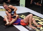 COLUMBUS, OH - MARCH 03: Ronda Rousey (top) attempts to submit Miesha Tate during the Strikeforce event at Nationwide Arena on March 3, 2012 in Columbus, Ohio. (Photo by Esther Lin/Forza LLC/Forza LLC via Getty Images)