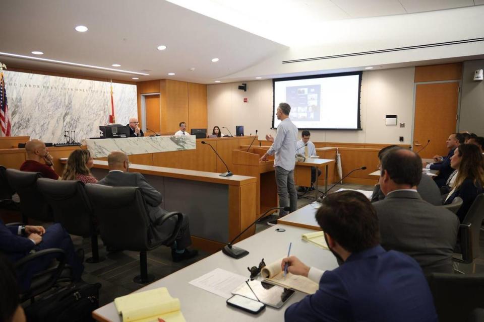 Oren Cytrynbaum, center, a victim of the Champlain Towers South collapse, speaks to Judge Michael Hanzman about his wishes for the future site. The Miami-Dade circuit judge presided over the status hearing for the Surfside condo collapse litigation with residents and their lawyers, along with the condo association’s legal representatives.