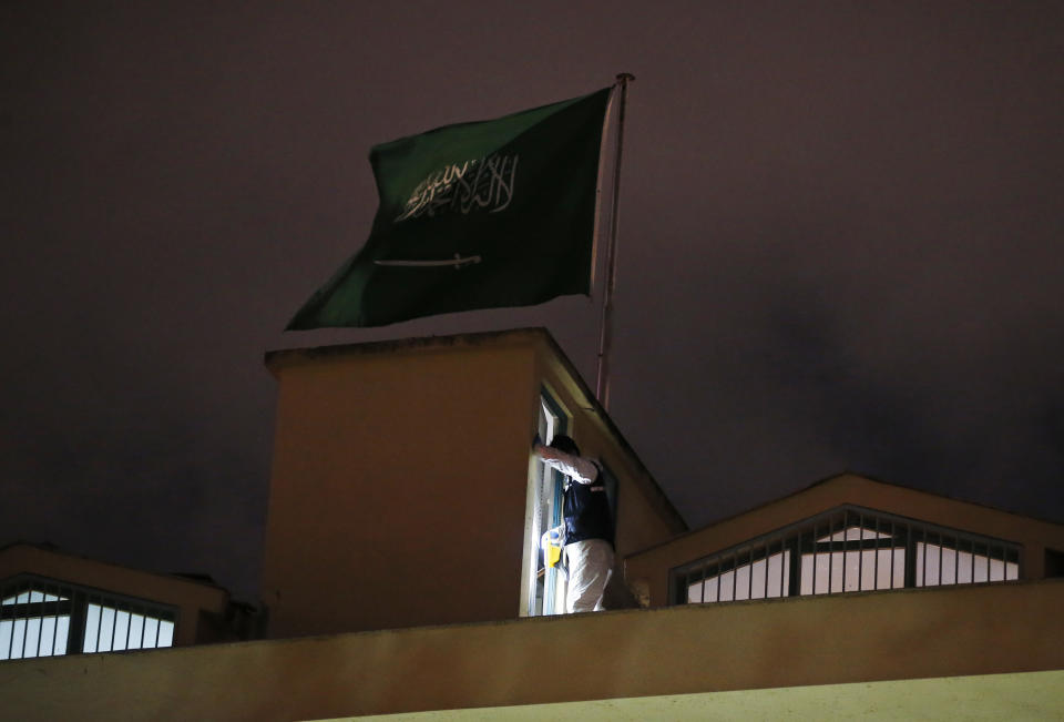 A Turkish forensic police officer searches for evidence as he works on the rooftop of the Saudi Arabia's Consulate in Istanbul, late Monday, Oct. 15, 2018. Turkish crime scene investigators dressed in coveralls and gloves entered the consulate Monday, nearly two weeks after the disappearance and alleged slaying of Saudi writer Jamal Khashoggi there. (AP Photo/Emrah Gurel)