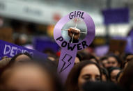 <p>Demonstrators attend a protest at the Puerta del Sol square during a one-day strike to defend women’s rights on International Women’s Day in Madrid on March 8, 2018. Spain celebrated International Women’s Day today with an unprecedented general strike in defense of women’s rights that saw hundreds of train journeys canceled and countless protests scheduled throughout the day. (Photo: Oscar Del Pozo/AFP/Getty Images) </p>