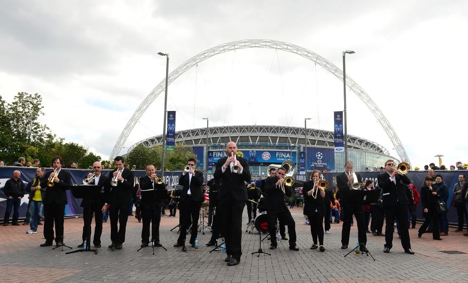 A trumpet band plays outside Wembley Stadium before the game.