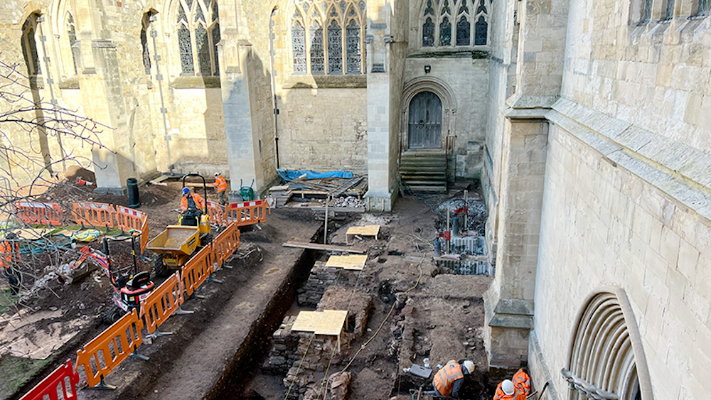  An aerial view of a cathedral undergoing an archaeological excavation. . 