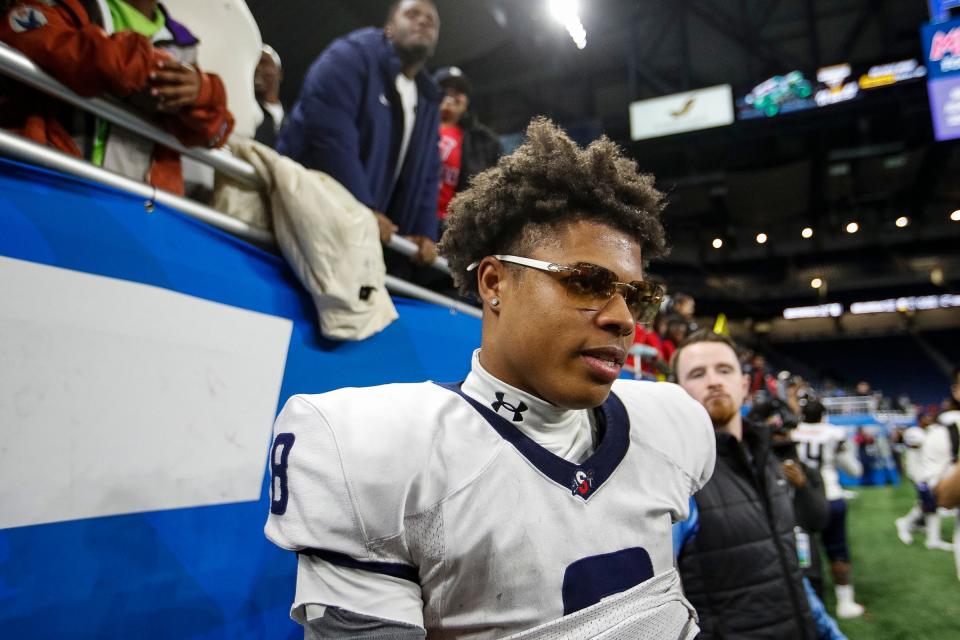 Southfield A&T quarterback Isiah Marshall celebrates a 36-32 win over Belleville at the Division 1 state final at Ford Field in Detroit on Sunday, Nov. 26, 2023.