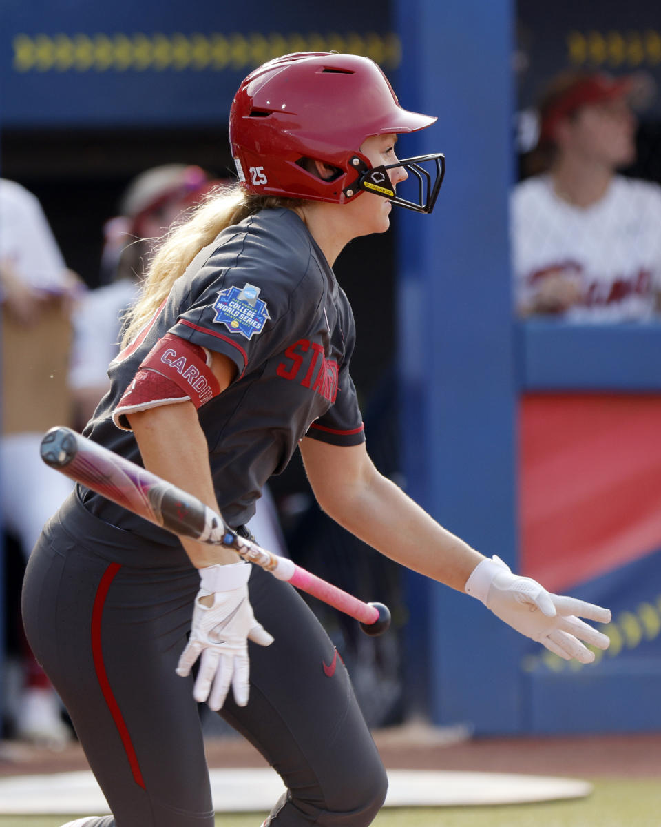 Stanford's Taylor Gindlesperger drops her bat after hitting a double against Alabama during the first inning of an NCAA softball Women's College World Series game Friday, June 2, 2023, in Oklahoma City. (AP Photo/Nate Billings)