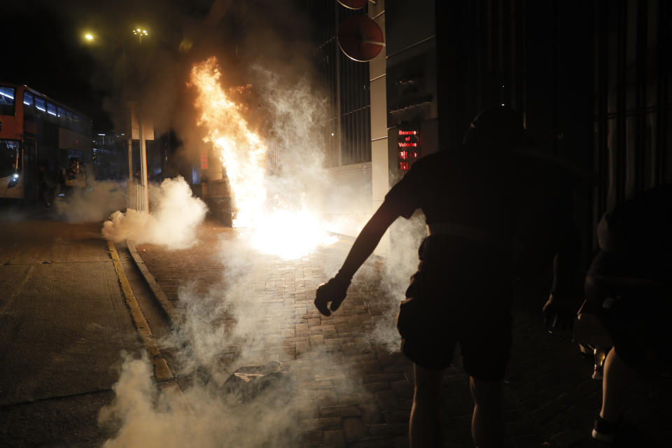 Police fire tear gas against protesters on the streets of Hong Kong on Wednesday, Oct. 2, 2019. Protests continue a day after police shot a teenage demonstrator at close range during widespread anti-government demonstrations on China's National Day and marked a fearsome escalation in Hong Kong's protest violence. (AP Photo/Kin Cheung)