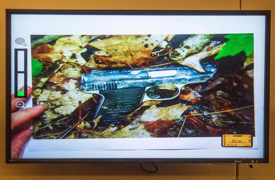 A photo of a small handgun found in a wooded area near the crime scene was displayed during the murder trial of the former New England Patriots player Aaron Hernandez at the Bristol County Superior Court in Fall River, Massachusetts February 13, 2015. REUTERS/Aram Boghosian/Pool (UNITED STATES - Tags: CRIME LAW SPORT FOOTBALL)