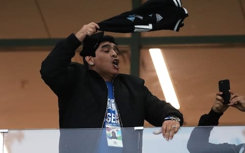 Argentina football legend Diego Maradona waves a shirt during the match against Croatia  - Credit: Ian MacNicol/Getty Images