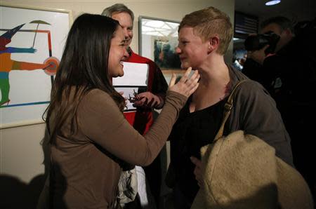 Marina Gomberg (L) is married to her partner Elenor Heyborne by Salt Lake City Mayor Ralph Becker in front of the Salt Lake County Clerks office in Salt Lake City, Utah, December 20, 2013. REUTERS/Jim Urquhart