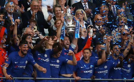 Soccer Football - FA Cup Final - Chelsea vs Manchester United - Wembley Stadium, London, Britain - May 19, 2018 Chelsea's Gary Cahill lifts the trophy as they celebrate winning the FA Cup REUTERS/Andrew Yates