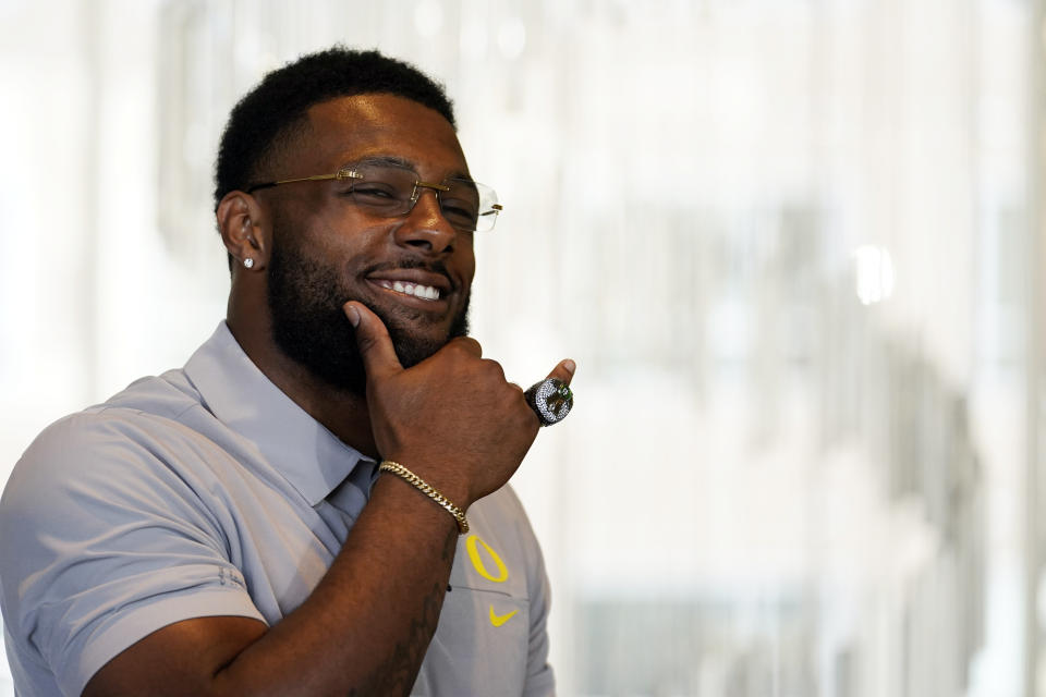 Oregon defensive end Kayvon Thibodeaux poses for photos during the Pac-12 Conference NCAA college football Media Day Tuesday, July 27, 2021, in Los Angeles. (AP Photo/Marcio Jose Sanchez)