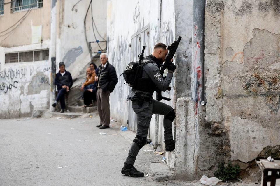 Israeli forces have been building up forces in the occupied West Bank after Friday’s attack on a synagogue (Reuters/Ammar Awad)