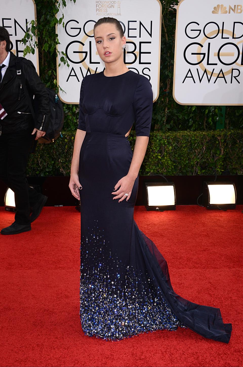 <p>En 2014, elle foule le tapis rouge des Golden Globes en robe Miu Miu.</p><br>