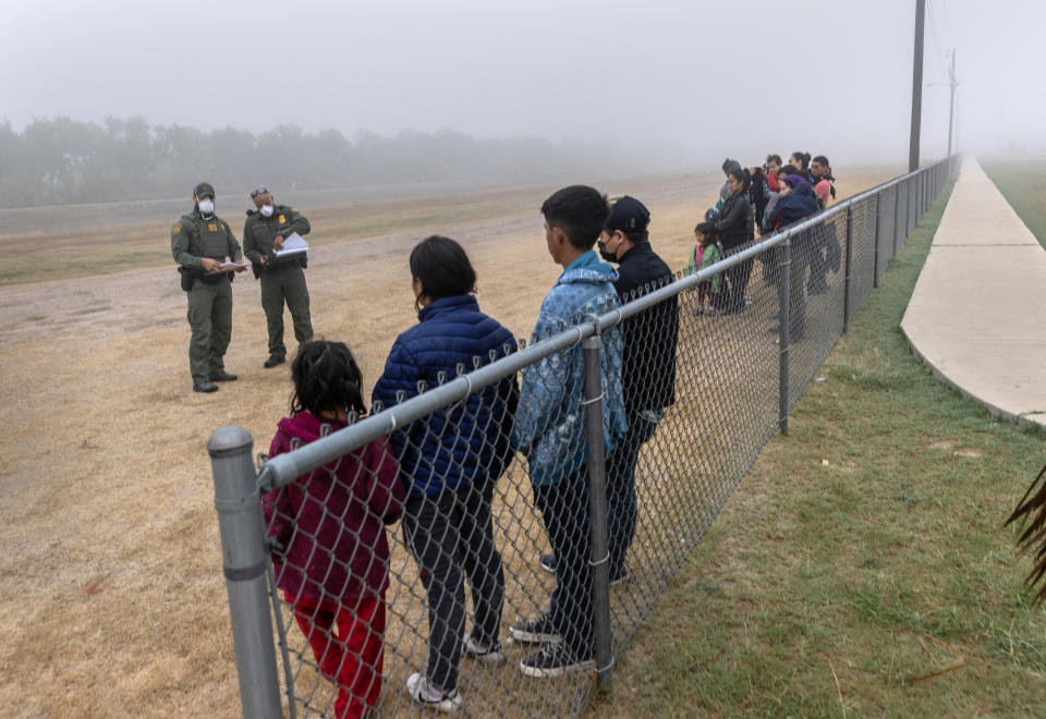 Unaccompanied minors are grouped apart from families waiting to be processed by U.S. Border Patrol agents near the U.S.-Mexico border on April 10, 2021 in La Joya, Texas. A surge of immigrants crossing into the United States, including record numbers of children, continues along the southern border. (John Moore/Getty Images)