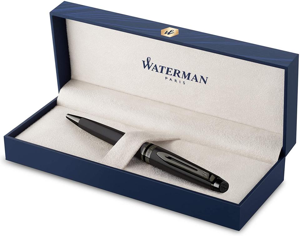 Black Waterman Expert Ballpoint Pen in white velvet case on a white background