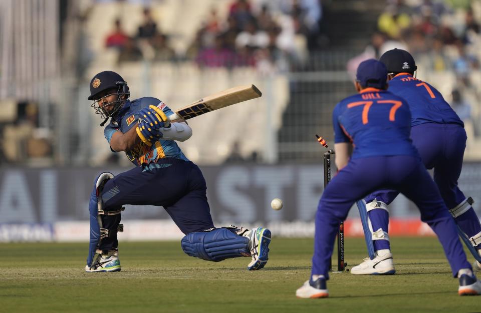 Sri Lanka captain Dasun Sanaka bowled by India's Kuldip Yadav during the second one-day international cricket match between India and Sri Lanka in Kolkata, India, Thursday, Jan. 12, 2023. (AP Photo/Bikas Das)