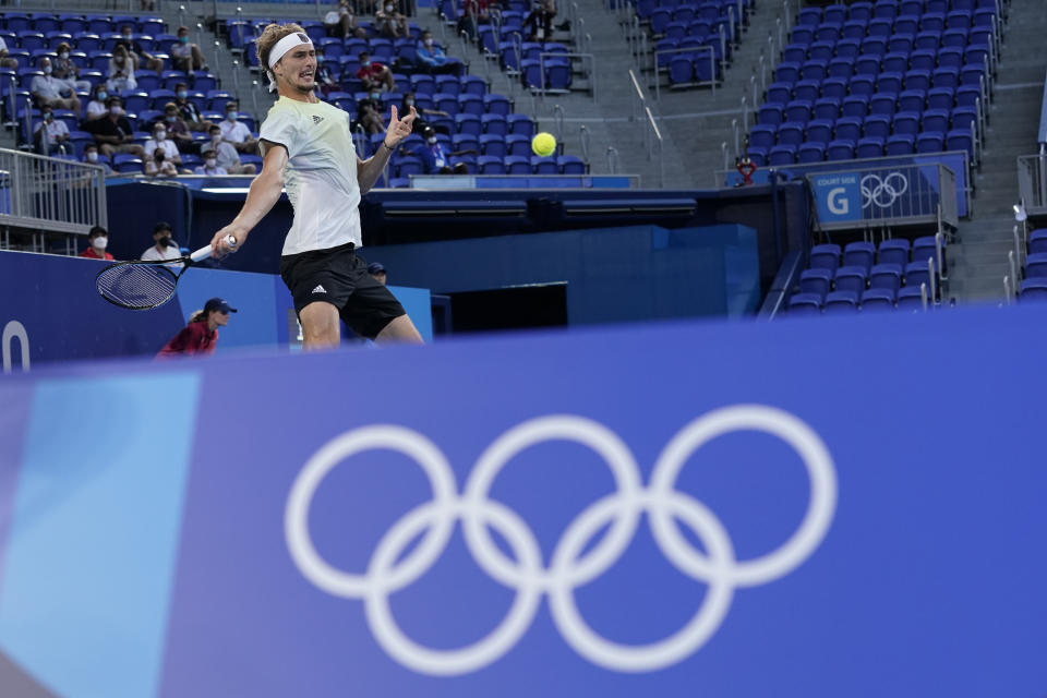 Alexander Zverev, of Germany, returns a shot to Karen Khachanov, of the Russian Olympic Committee, during the men's single gold medal match of the tennis competition at the 2020 Summer Olympics, Sunday, Aug. 1, 2021, in Tokyo, Japan. (AP Photo/Patrick Semansky)